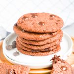 chocolate peppermint cookies in a stack on a plate.