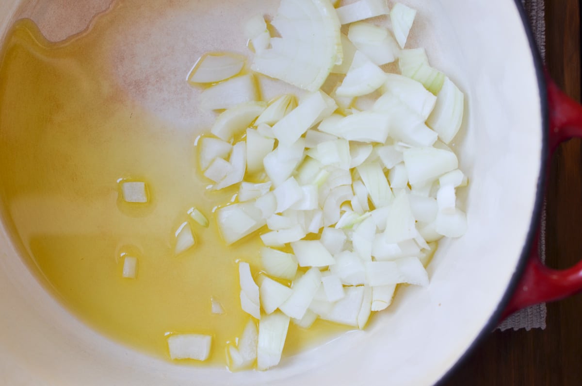 olive oil and chopped onions sauteing in a stock pot.