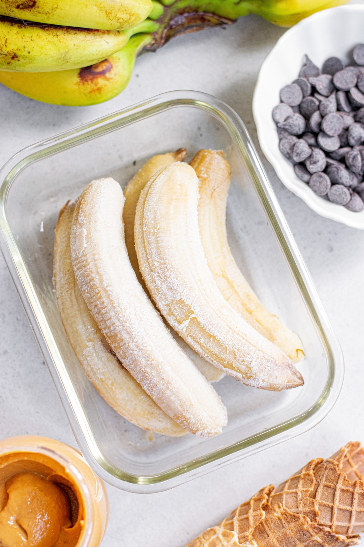 frozen bananas and ingredients for ice cream.