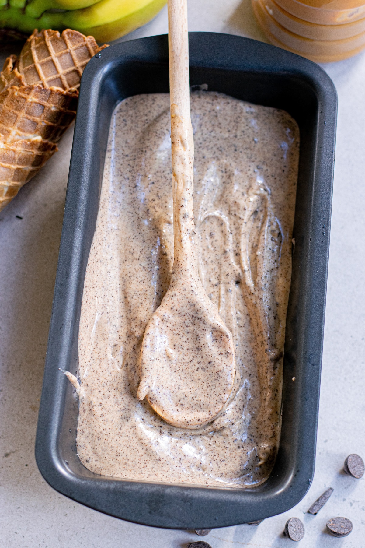 blended banana ice cream in metal loaf pan.