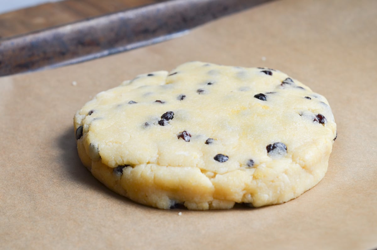gluten-free scone dough on parchment lined baking sheet.
