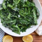 kale salad in a white bowl.