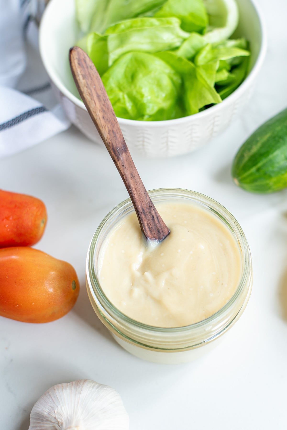 tahini dressing in a glass jar.