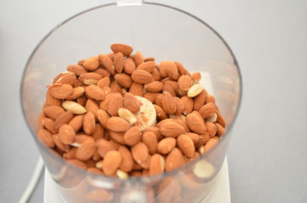 Easy Homemade Almond Butter - nuts in food processor -24 Carrot Kitchen