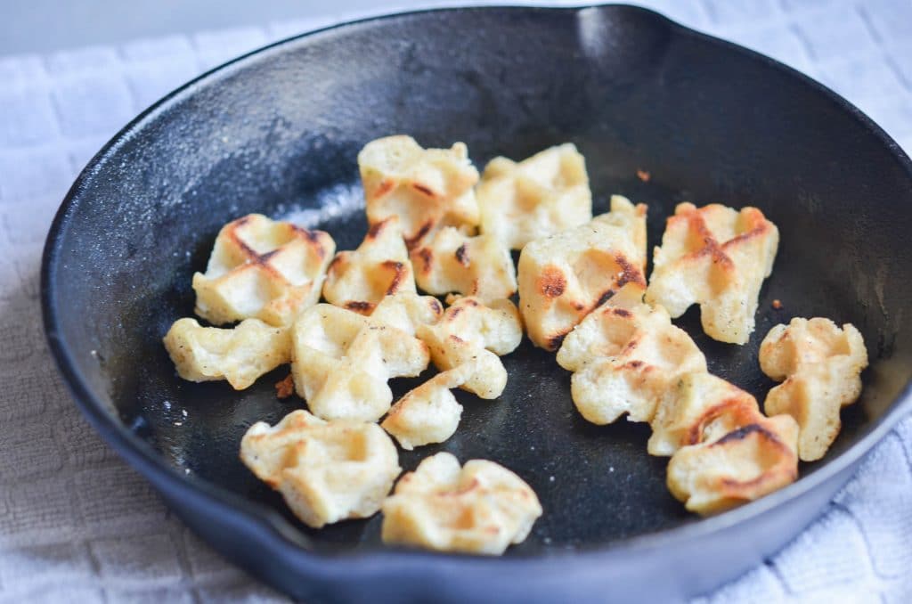 Croutons toasting in cast iron skillet