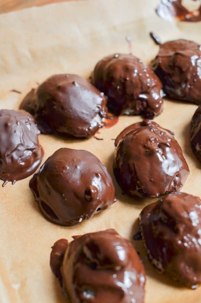 Homemade mounds bars on baking pan.