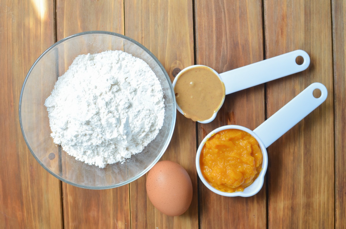 ingredients for peanut butter dog treats on the counter.