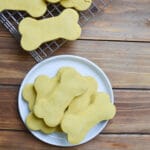 peanut butter dog treats on a white plate.