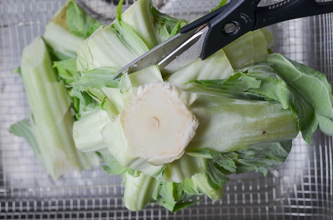 Cutting cauliflower pieces.