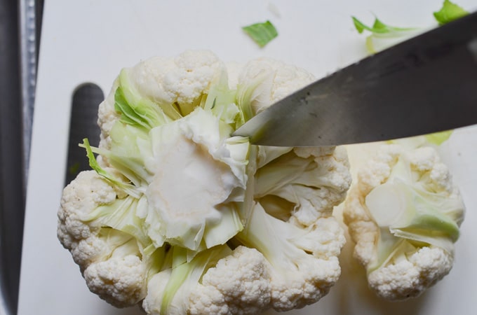 cutting cauliflower pieces.