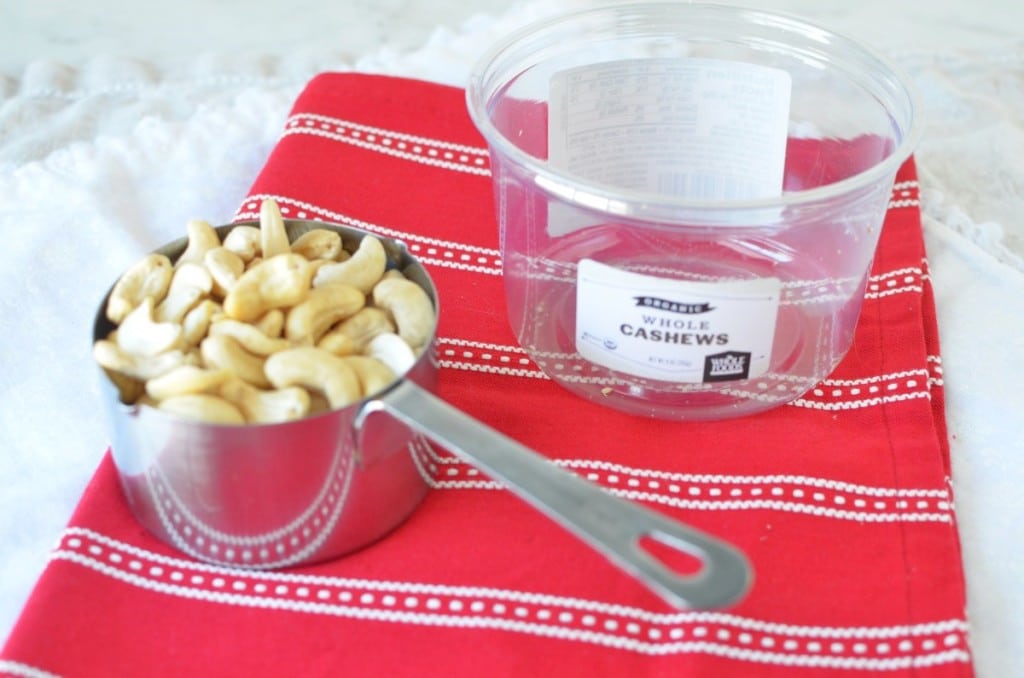 Cashews in measuring cup on table - 24 Carrot Kitchen