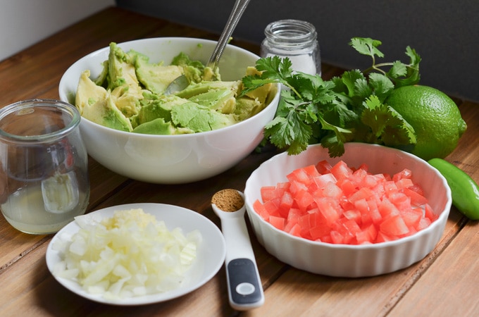 ingredients for guacamole on counter.