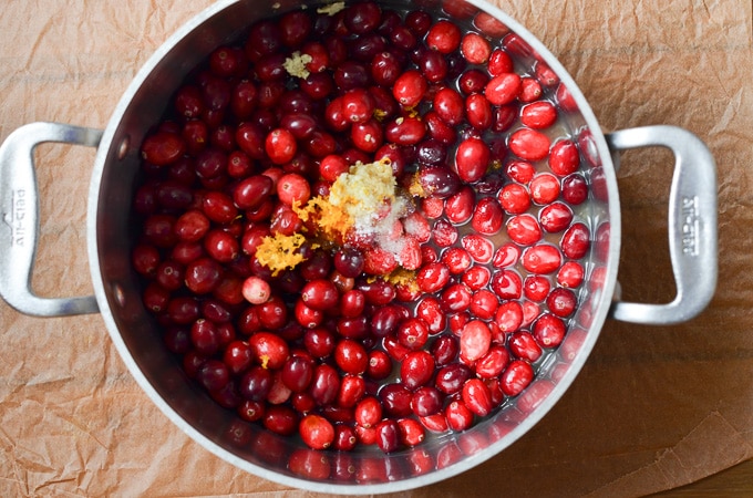 ingredients for Paleo cranberry sauce in pot.