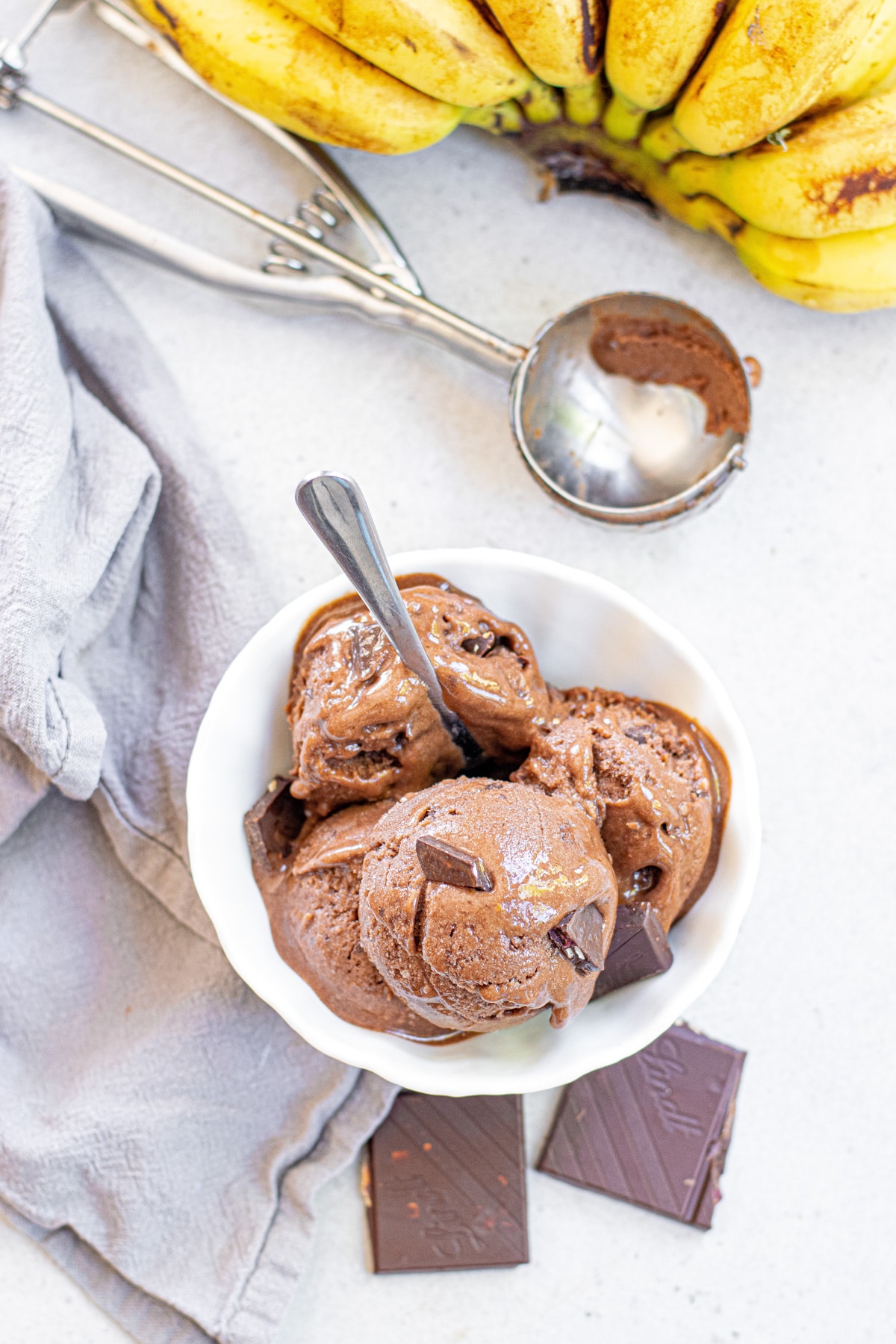 bowl of scoops of chocolate banana ice cream.