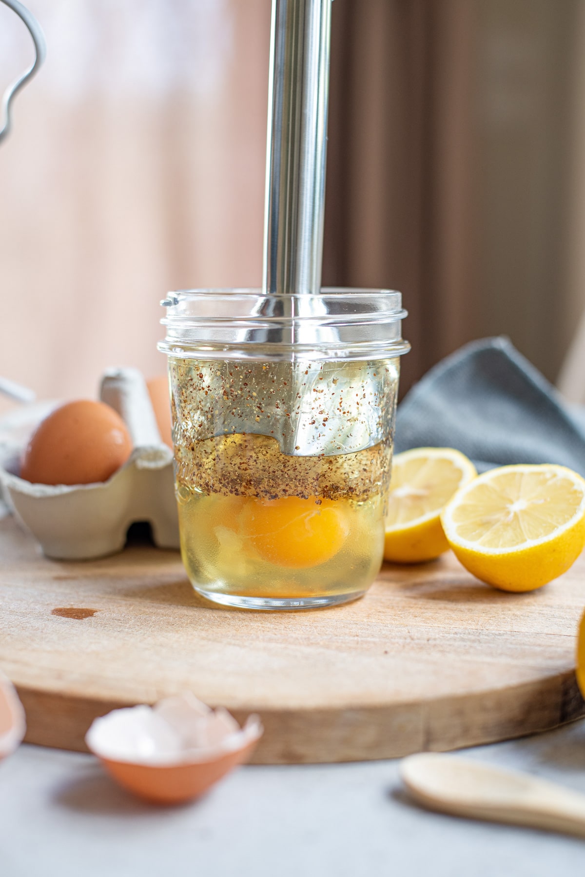 ingredients in jar with immersion blender.