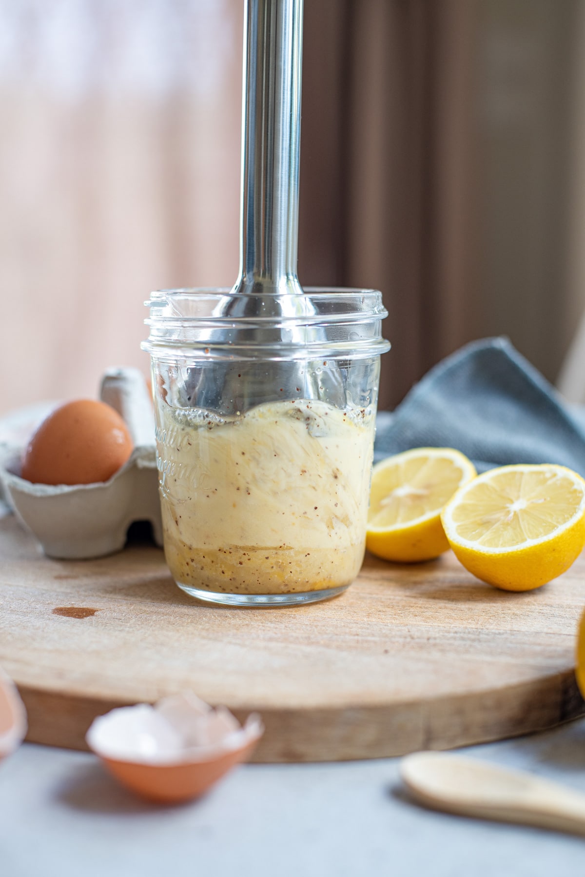 blending ingredients in glass jar.