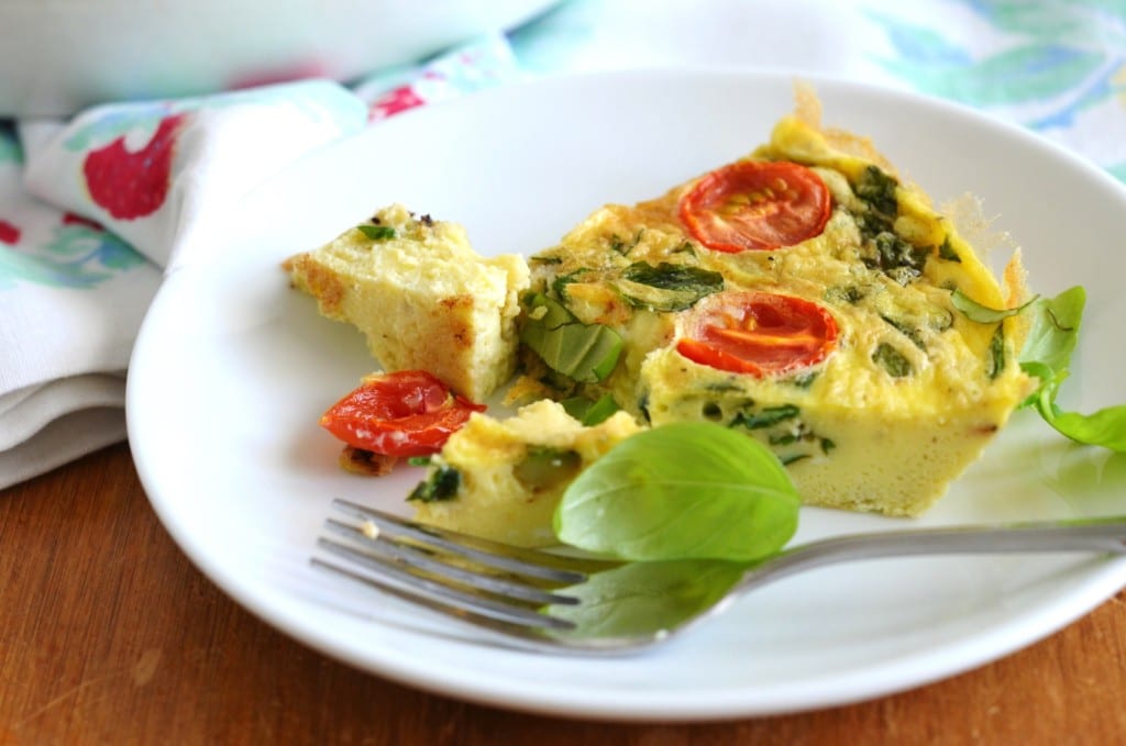 Paleo Fritatta with tomatoes and basil on plate - 24 Carrot Kitchen