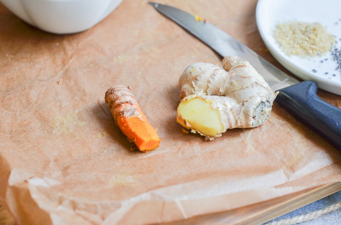 Turmeric and ginger on counter.