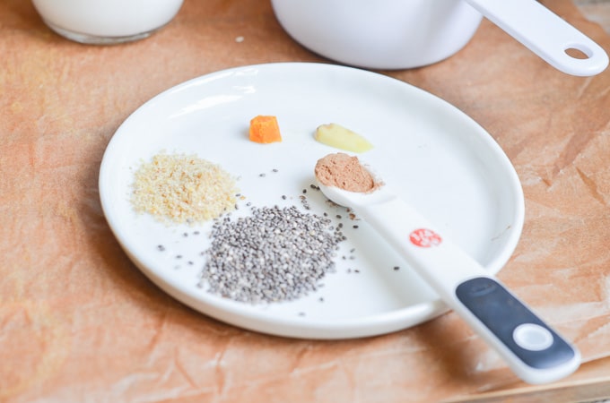 Chia Seeds, Ground Flax seeds, ginger, turmeric and cinnamon on a plate.