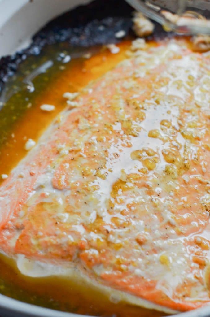 orange glazed salmon in casserole dish out of oven.