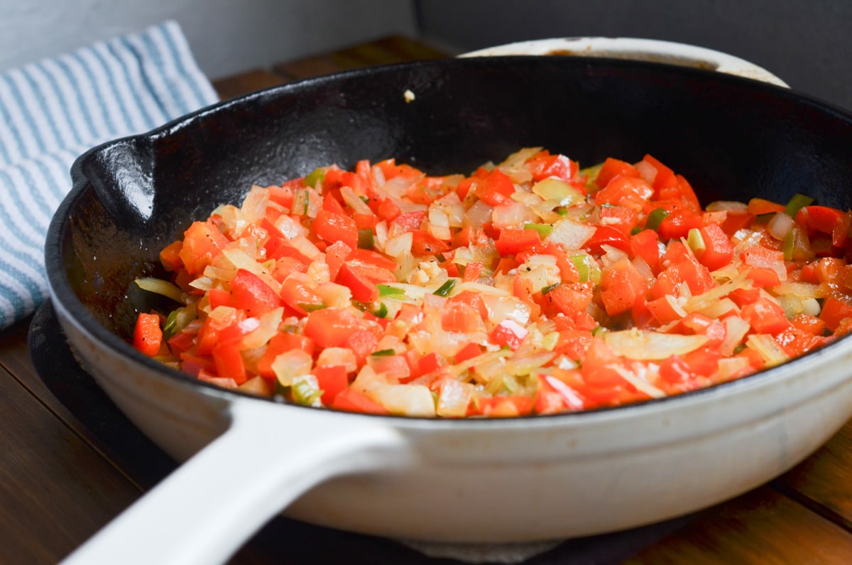 onions, garlic and red peppers in cast iron skillet.