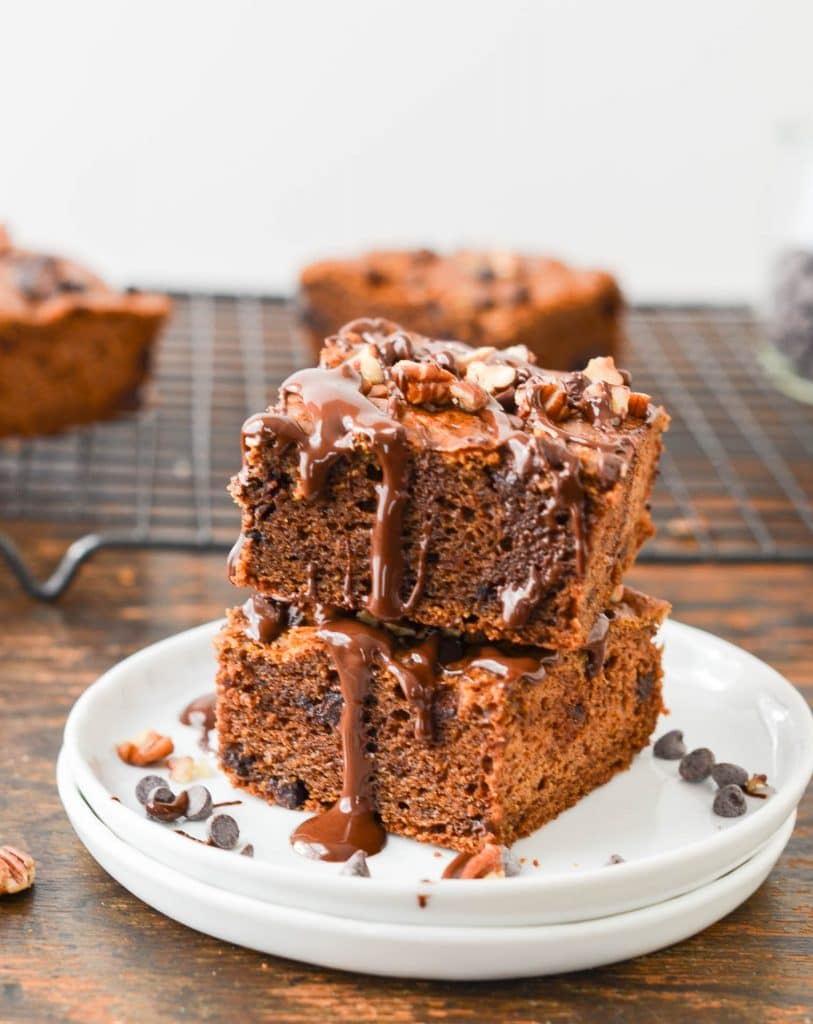 Paleo Pumpkin Bars on a plate with chocolate sauce - 24 Carrot Kitchen