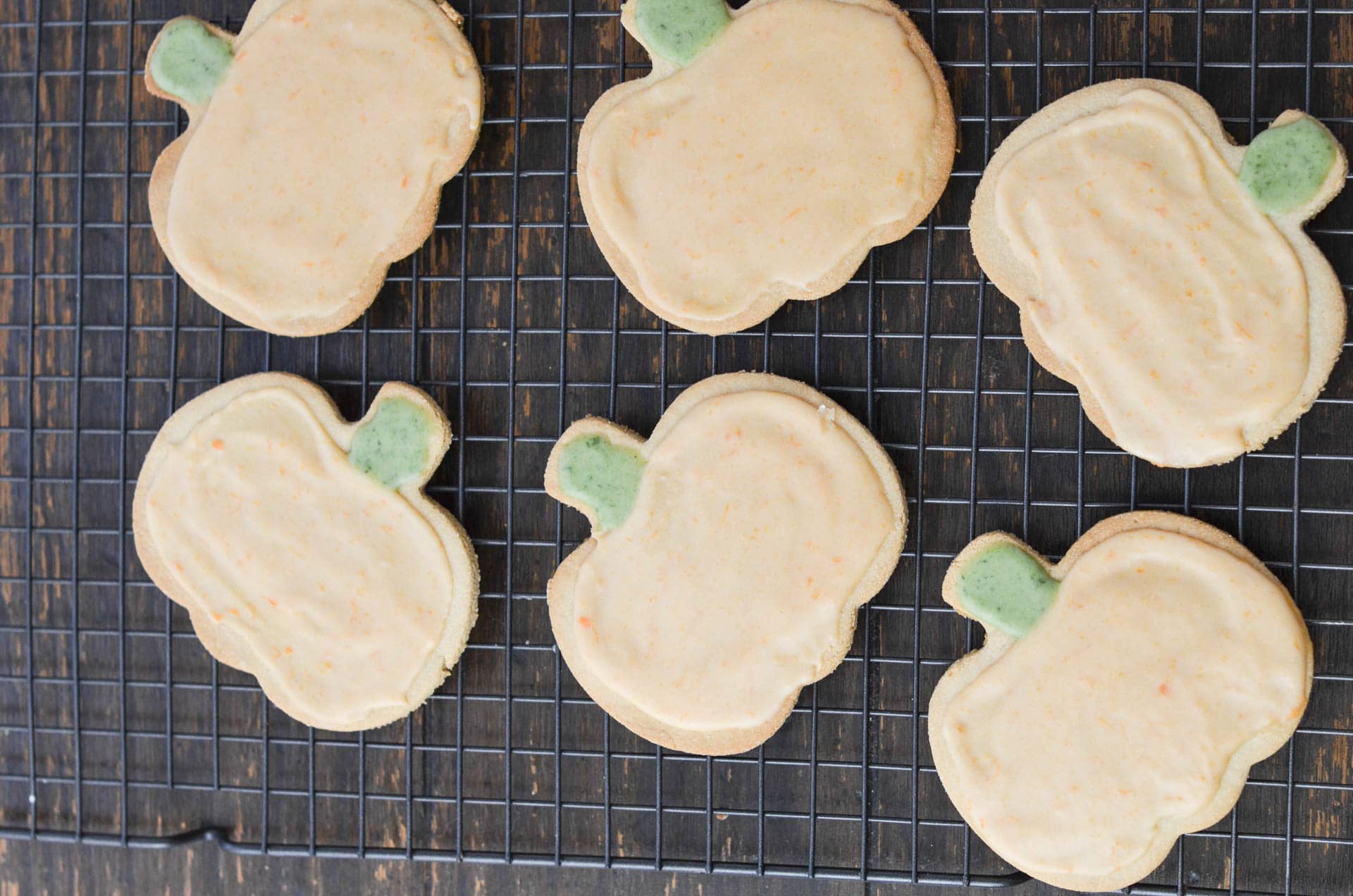 vegan sugar cut out cookies decorated on cooling rack.