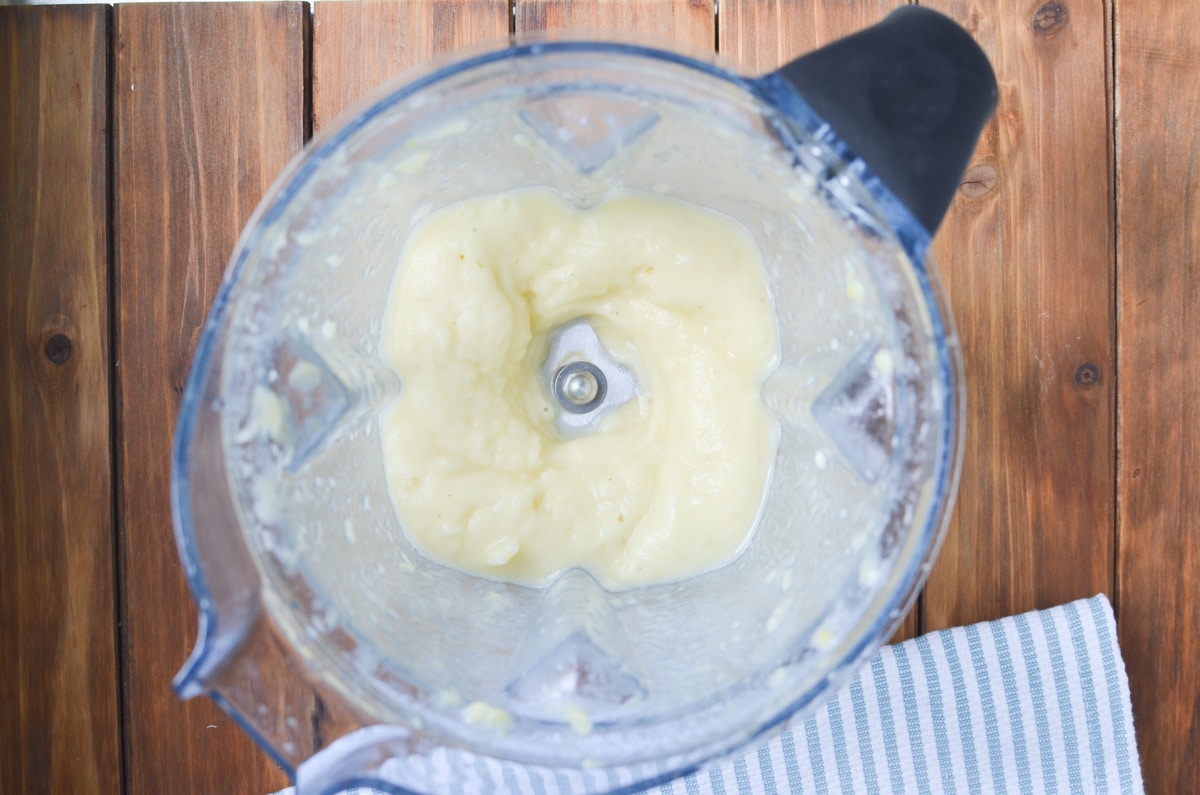 pina colada ingredients in high-speed blender.