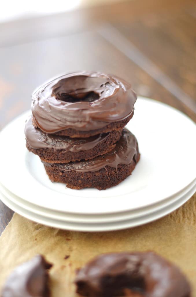 Chocolate Vegan Donuts Recipe donuts stacked on plate - 24 Carrot Kitchen