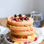 Paleo Waffles on a plate with berries - 24 Carrot Kitchen