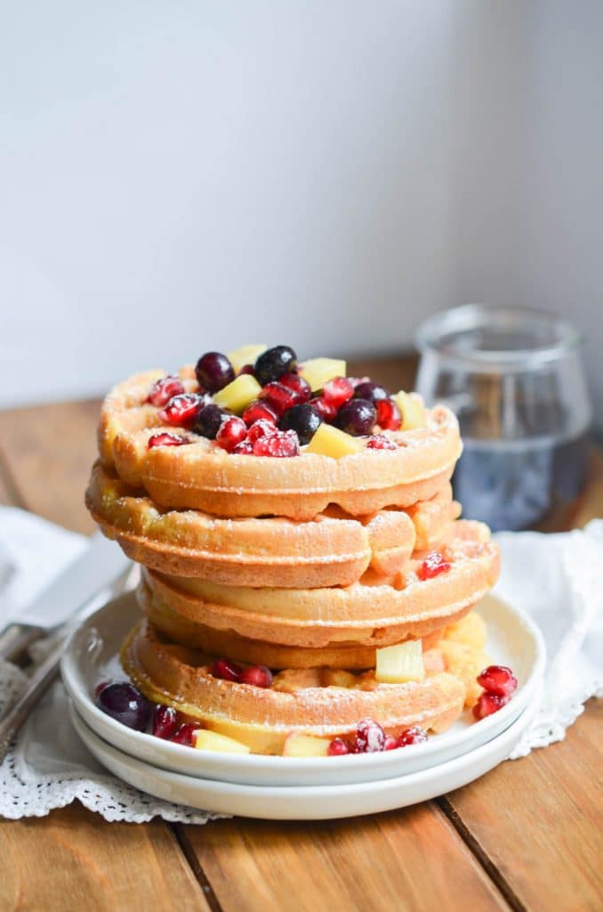 Eggless Waffles on a plate with berries - 24 Carrot Kitchen