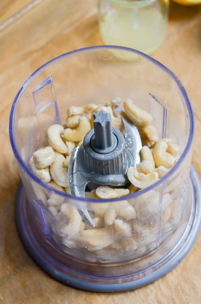 ingredients for vegan cream cheese in small food processor.