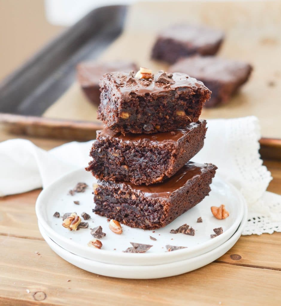 Gluten-Free Vegan Brownies stacked on plate - 24 Carrot Kitchen