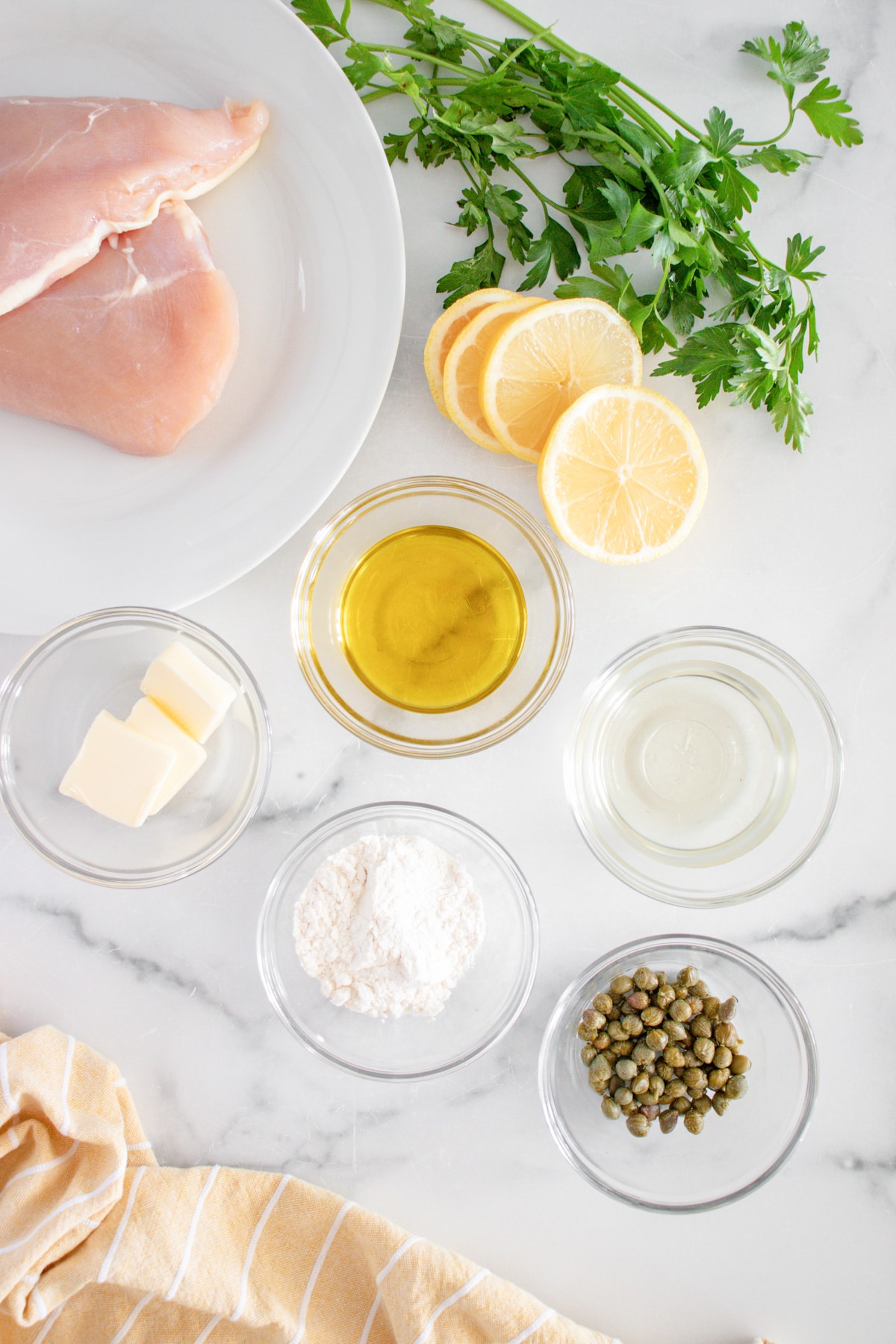 ingredients for chicken piccata on the counter.