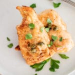 chicken piccata on a plate.