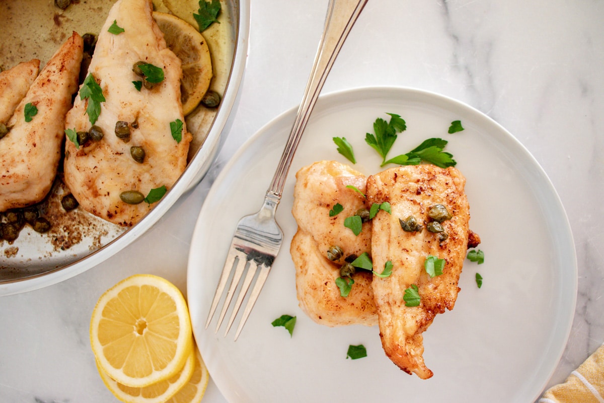 chicken piccata on a plate.