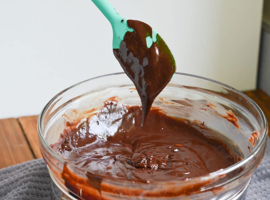 melted dairy-free chocolate ganache in pot.