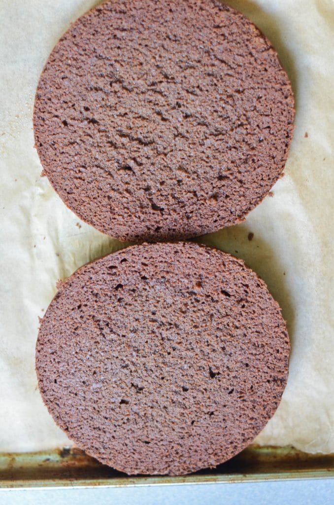 Paleo Chocolate Cake sliced in half, ready for frosting. - 24 Carrot Kitchen