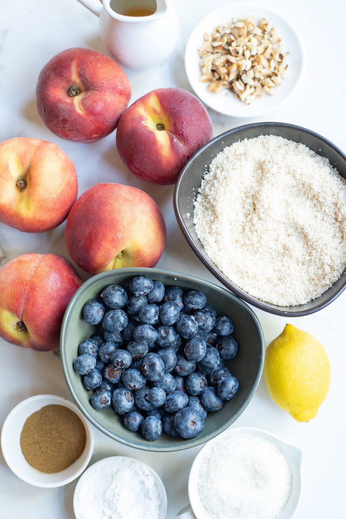 ingredients for peach blueberry crumble on the counter.