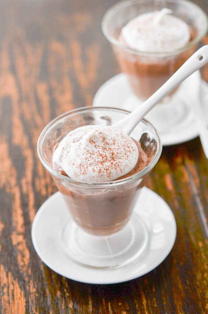 Vegan Chocolate Mousse in a bowl with coconut whipped cream - 24-carrot-kitchen