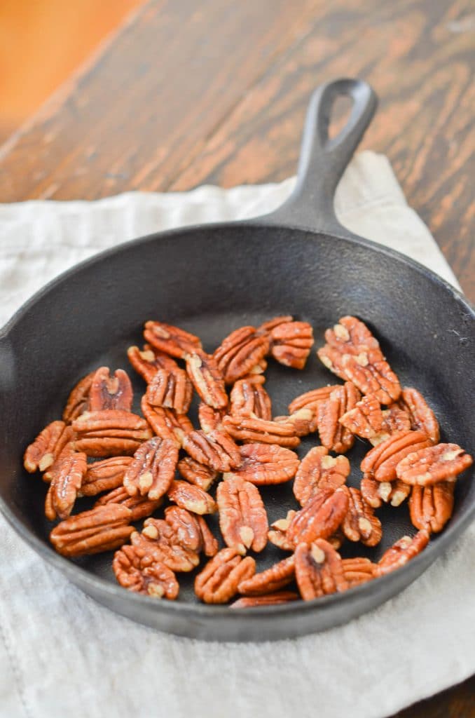 Maple Pecans in cast iron skillet - 24 Carrot Kitchen