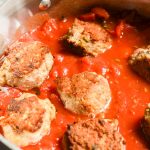 Paleo Turkey Meatballs with tomato sauce in pot - 24 Carrot Kitchen