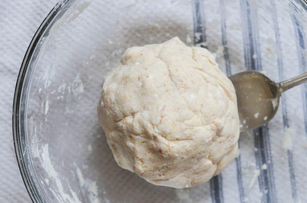 Vegan cinnamon roll dough in mixing bowl - 24 Carrot Kitchen