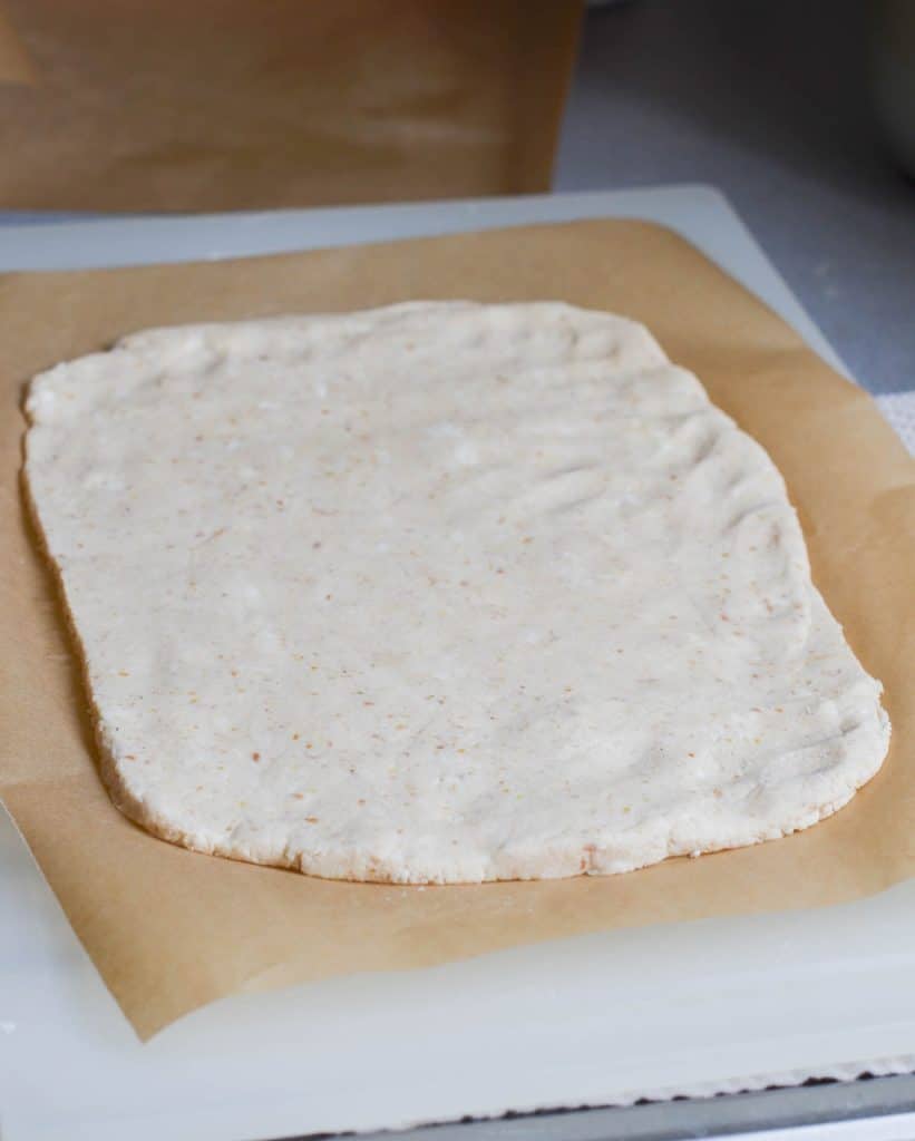 Vegan Cinnamon Rolls dough rolled out on board - 24 Carrot Kitchen