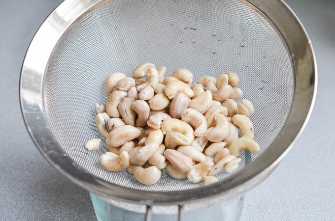 Soaked cashews drained in strainer. - 24 Carrot Kitchen