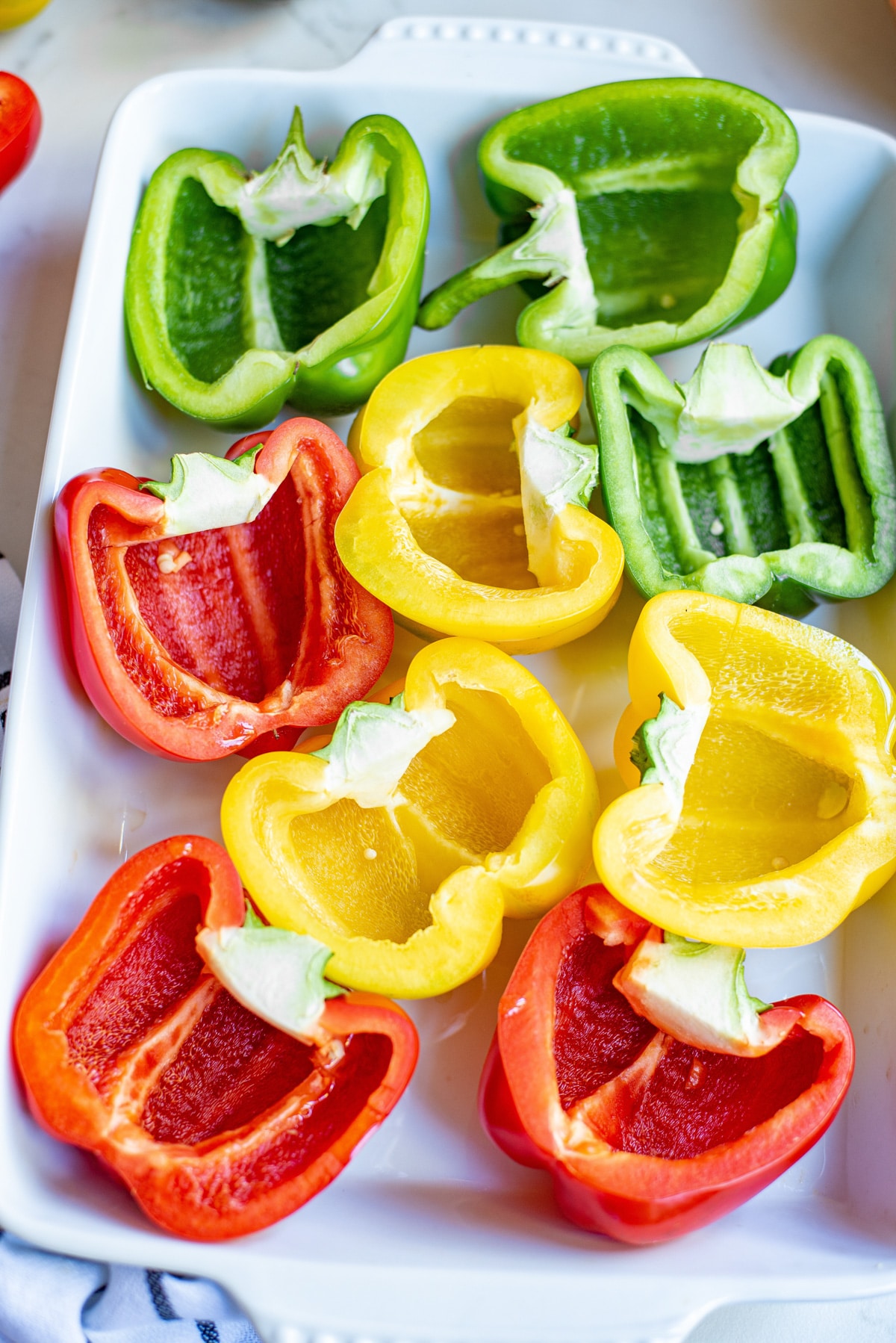 cut bell peppers in a casserole dish.