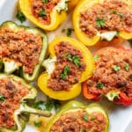 baked stuffed peppers in a casserole dish.