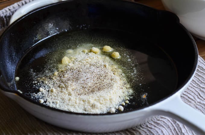 Ingredients for vegan scalloped potatoes in cast iron skillet.