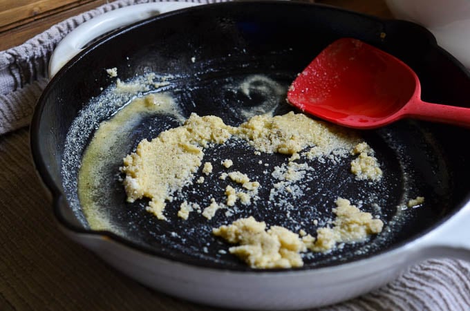 Ingredients for vegan scalloped potatoes in cast iron skillet.