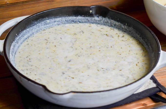 Dairy-Free Milk and Herb mixture in cast iron skillet.